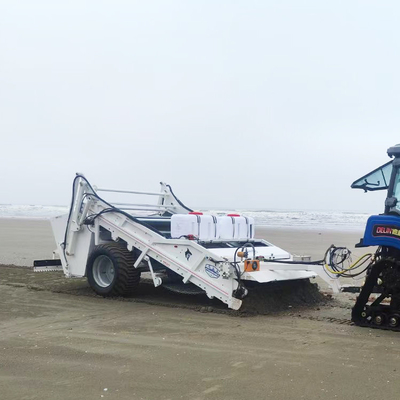 Traktor zamiatacz plaży do czyszczenia zasadowego, ciągany do przesiewania odpadów z suchego lub mokrego piasku
